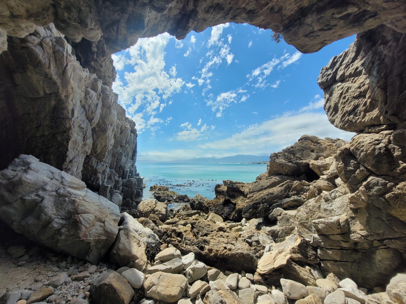 Ocean framed by the rock opening of Klipgat Caves